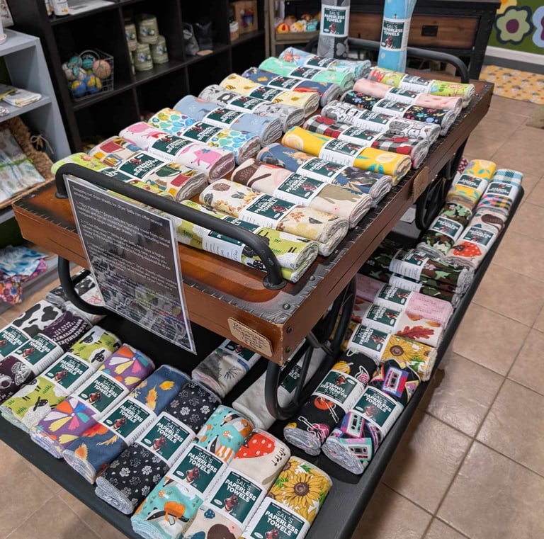 a table with a carton of cloth covered with a variety of cards