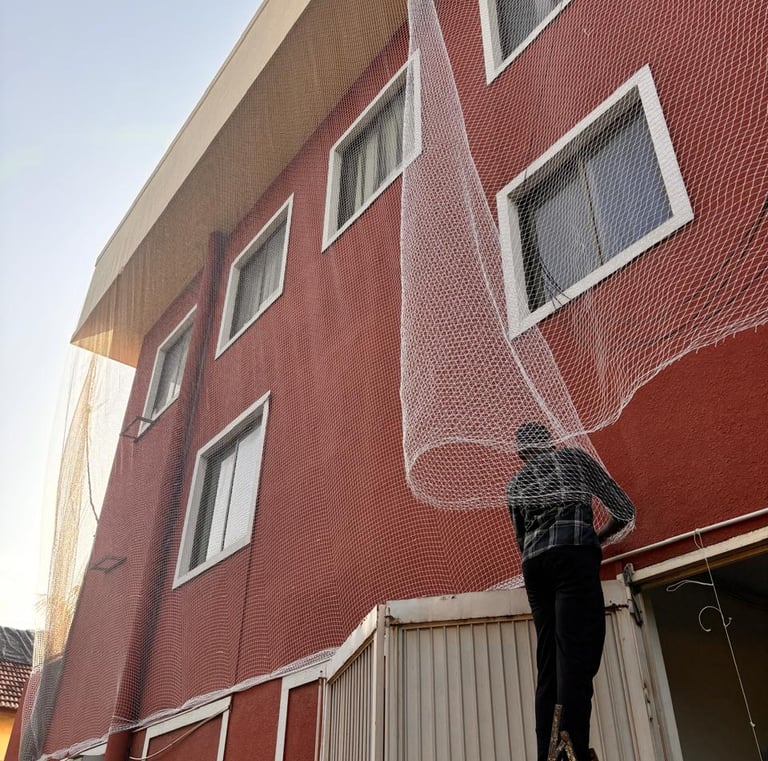 Close-up of a sturdy monkey safety net tightly secured on a balcony in Bengaluru.
