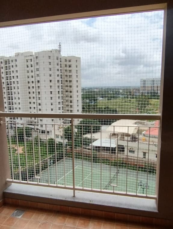 A balcony safety net blending seamlessly with the building’s exterior in Ambattur.
