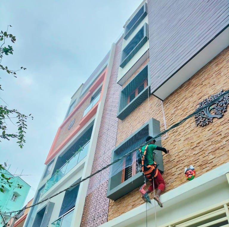 Close-up of a securely fitted balcony safety net in a modern Adyar apartment.