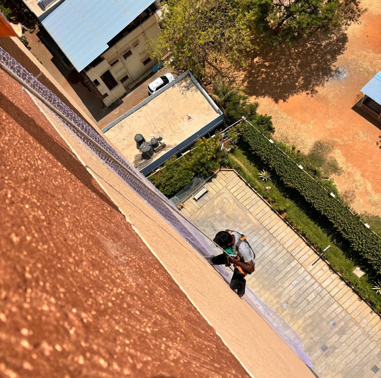 Close-up of a sturdy anti pigeon net tightly secured on a balcony in T Nagar.