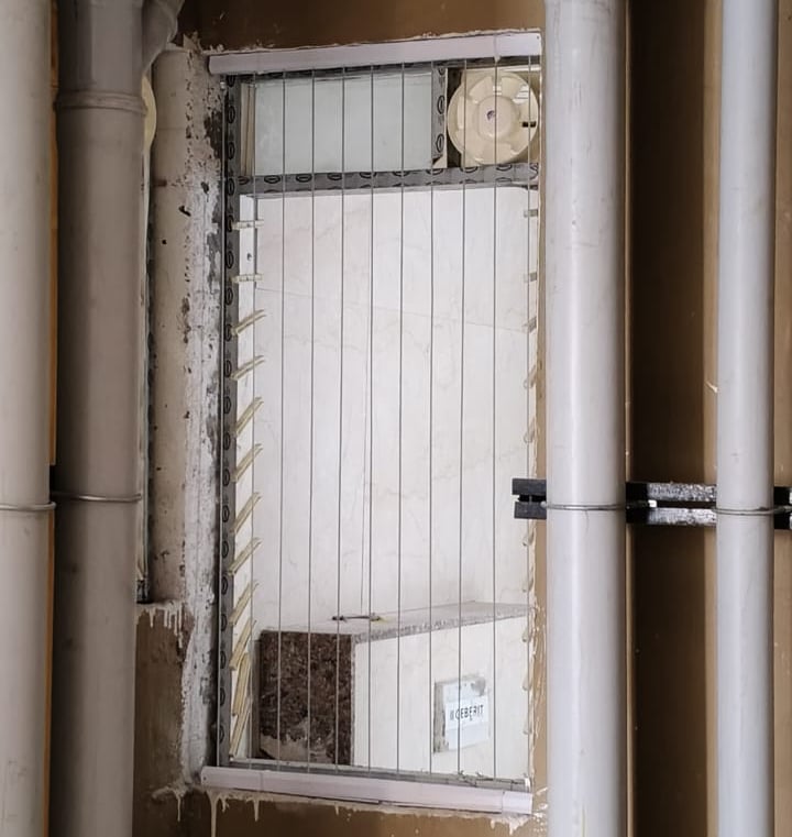 Evening scene of a balcony with invisible grills softly lit by ambient lighting