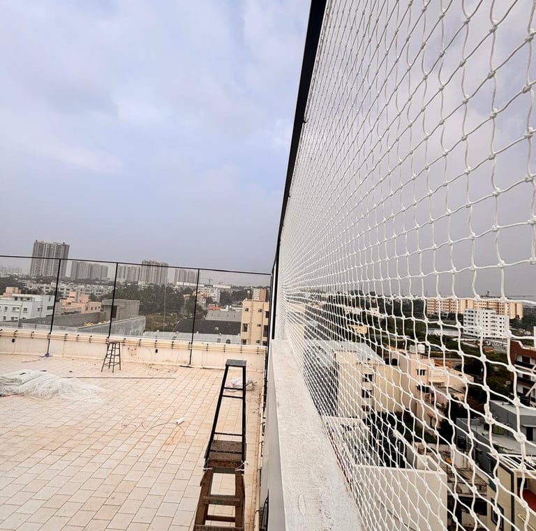 Close-up view of sturdy netting material tightly secured around a terrace sports area
