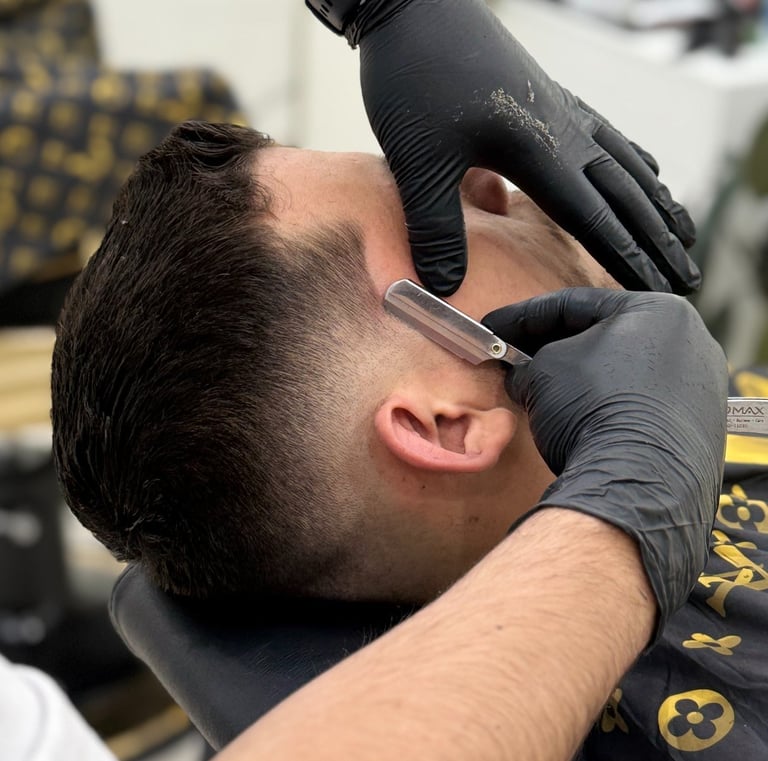 Traditional straight razor shave with hot towel service at Unlimited Barbershop Etobicoke.