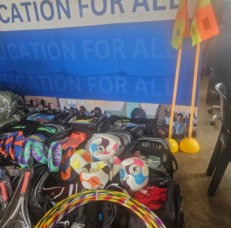 a bunch of bags with sports items and a wall banner