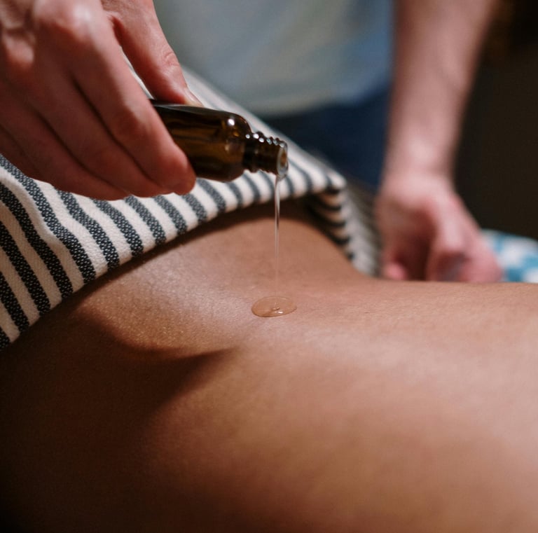 a person is getting a massage at a spa with oil
