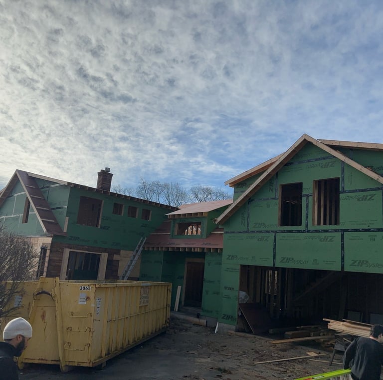 a man is working on a house being built