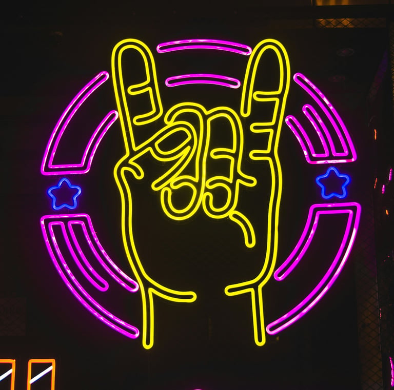Yellow neon rock on hand gesture sign with pink circular border and blue stars.