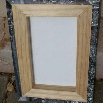 Back view of a wooden frame for a canvas print, showing the stretched canvas.
