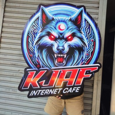 Sintra board sign with a glowing wolf head logo and 'KJAF Internet Cafe' text.