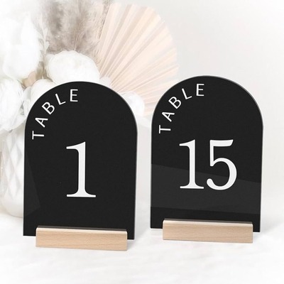 Black acrylic table numbers 1 and 15 with wooden bases.