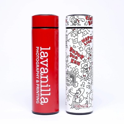 Red tumbler with 'lavanilla Photography & Printing' and a white tumbler with cartoon illustrations.