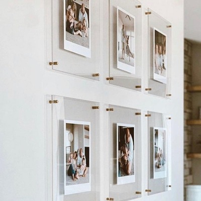 Grid of six acrylic frames displaying family photos.
