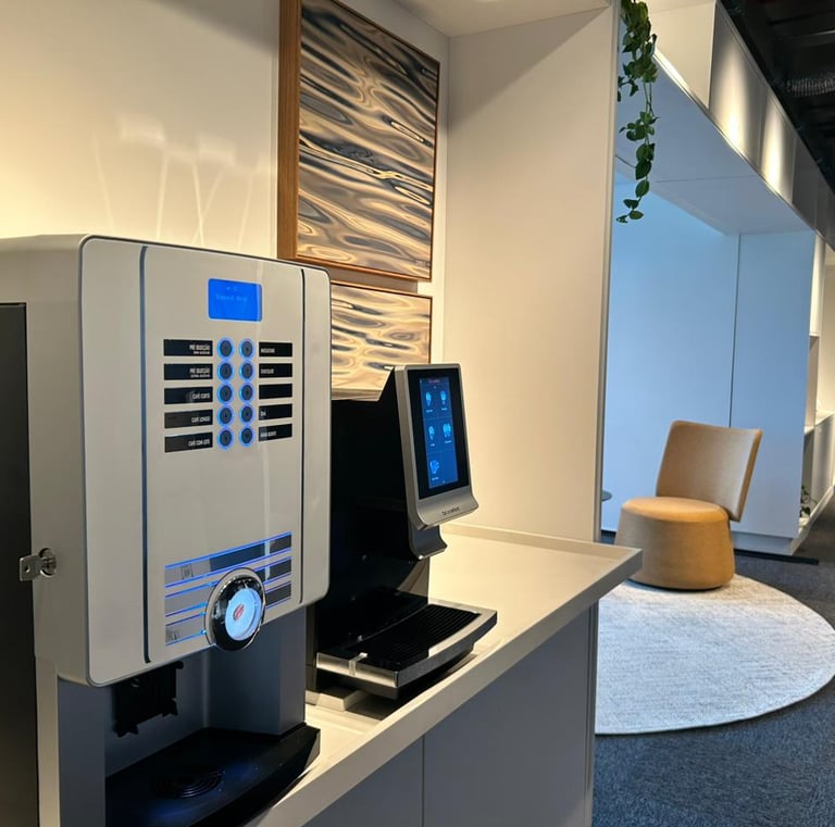 a coffee machine in a room with a chair and a chair