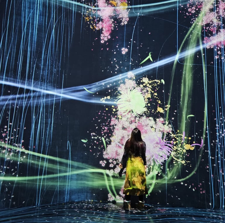 a woman in a yellow dress standing in front of a large screen with a painting