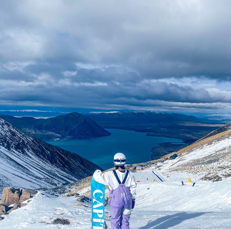 a person standing on a snowy mountain top