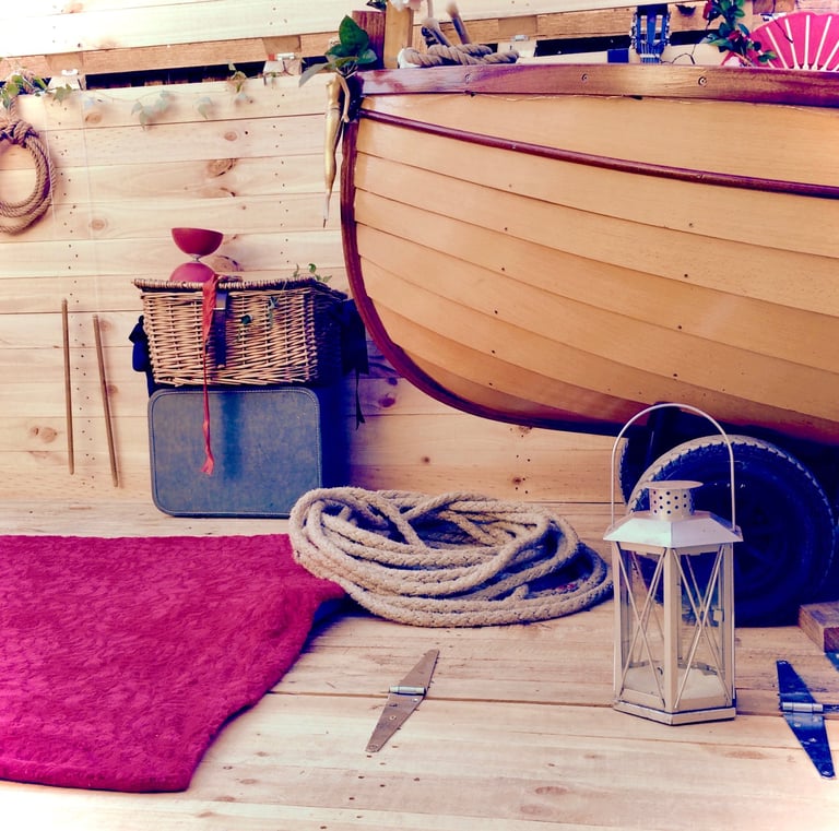 a wooden boat with lovely circus props