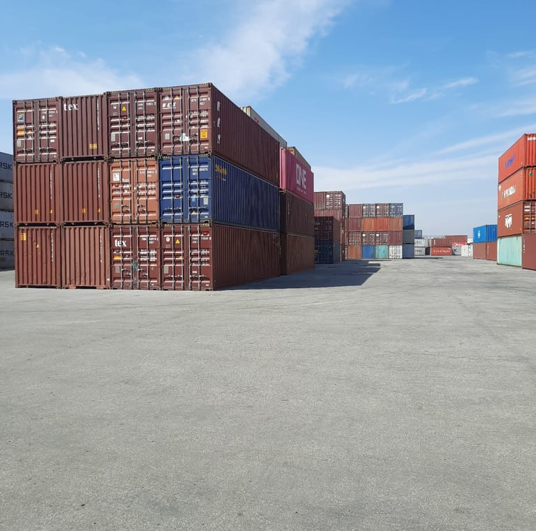 a lot of containers stacked on top of each other