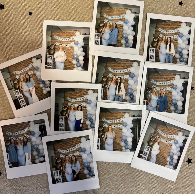 Polaroid photos from a baby shower showing guests by a blue balloon arch and teddy bear backdrop.