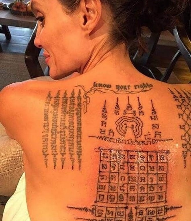 angelina jolie with thai tattoos sak yant on her back and a tattoo on her back
