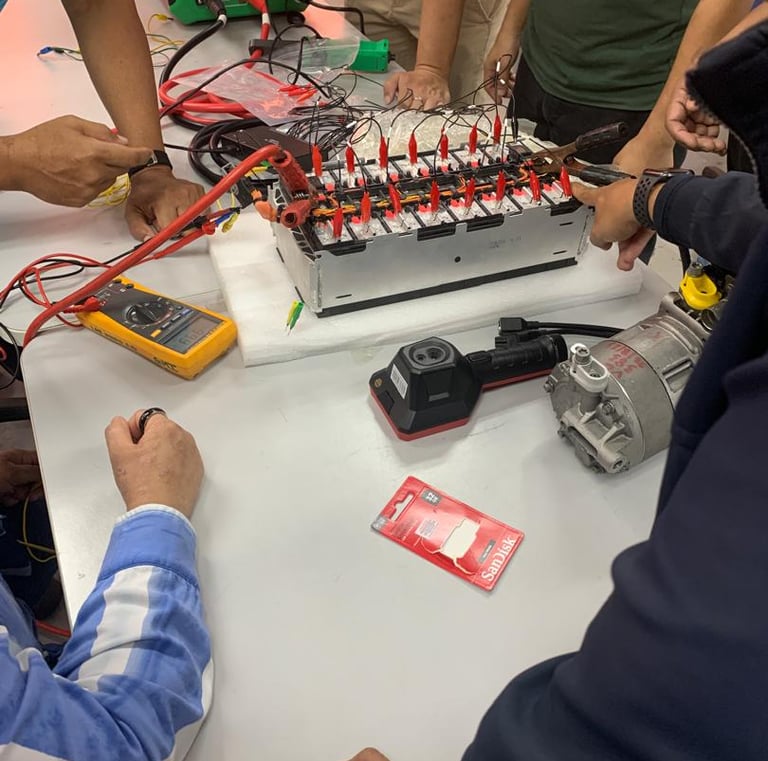 a group of people hands on electrical engineering