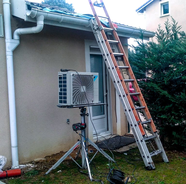 Lifting an air conditioning outdoor unit onto a roof.