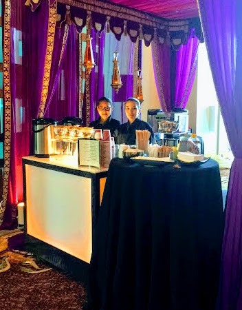 a man standing in front of a table with a table cloth