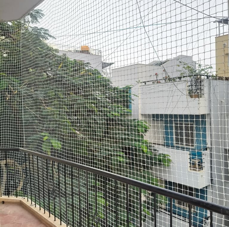 Close-up of durable knots and mesh in a safety net designed for lacony protection.