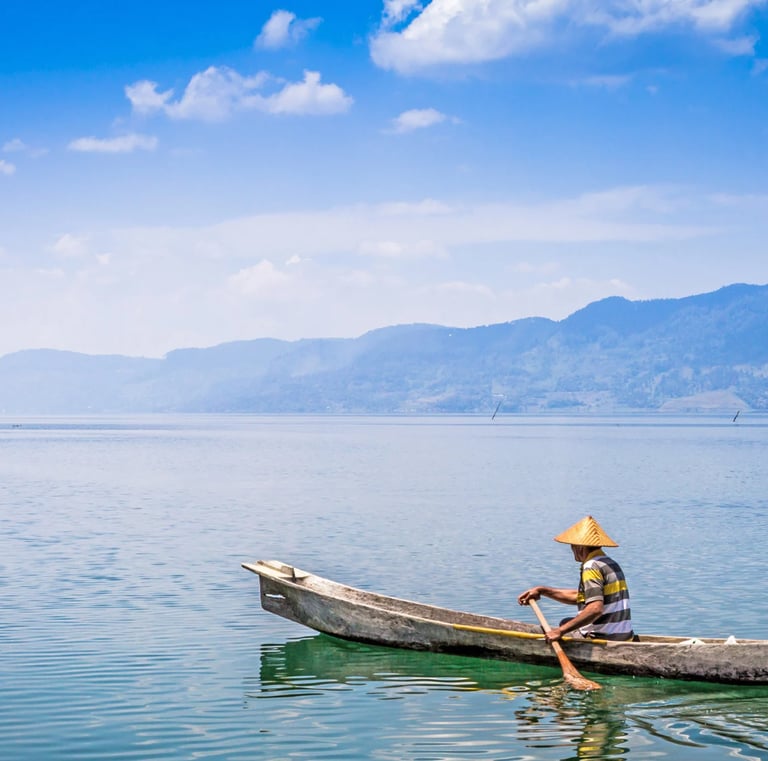 a man in a hat and a hat on a boat - SEMATA INDONESIA Program