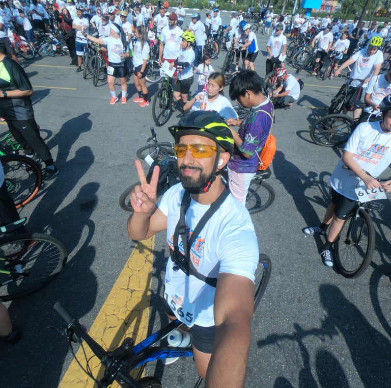 a man in a helmet and sunglasses on a bike