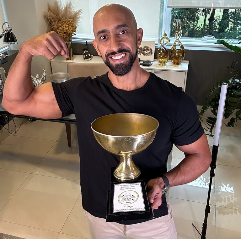 a man with a trophy in a room
