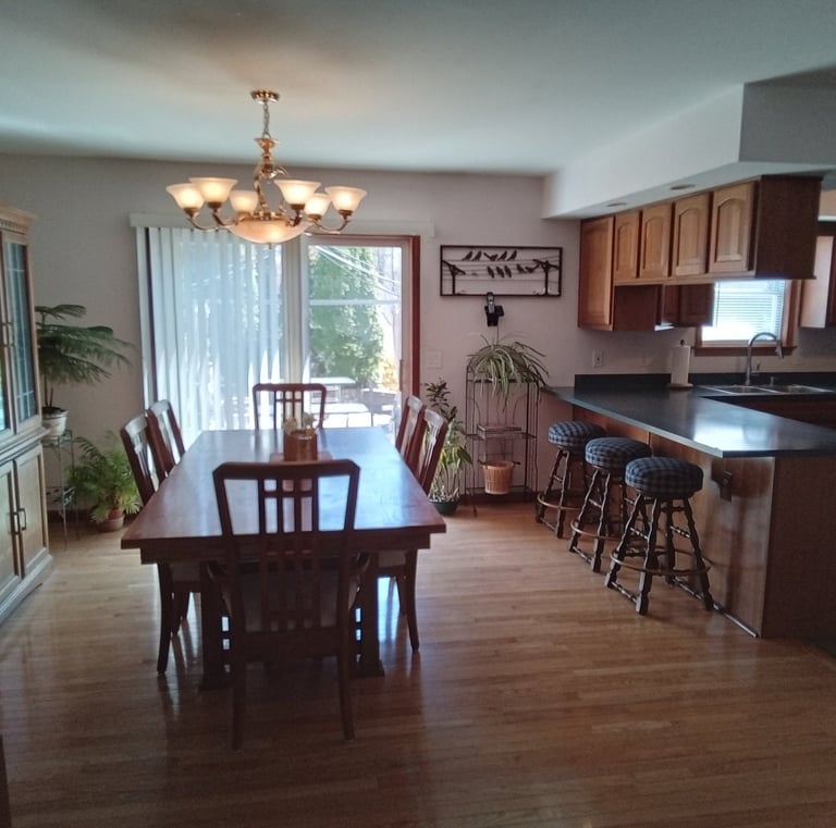 large dining area with dining room table and hutch
