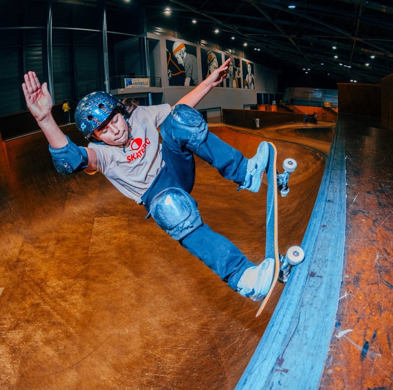 a skateboarder is doing tricks on a ramp pomge Marseille France skatepark