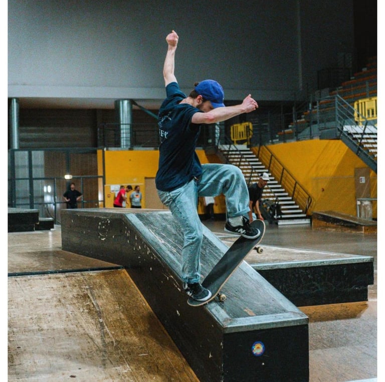 a man riding a skateboard on a ramp pomge Marseille France skatepark