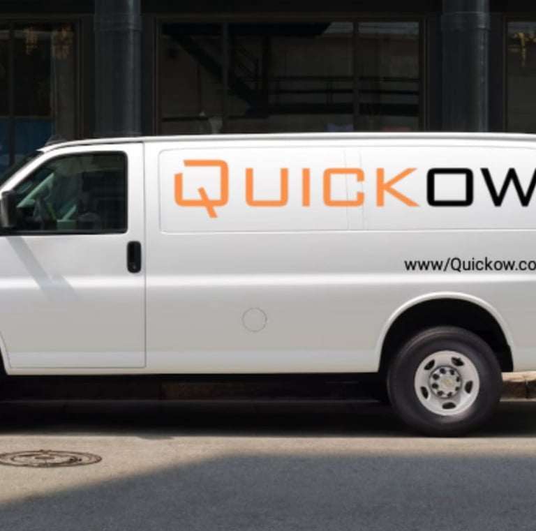 a man moving boxes into a truck