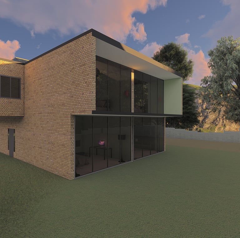 Modern two-story brick house with large glass windows and a green lawn at sunset.