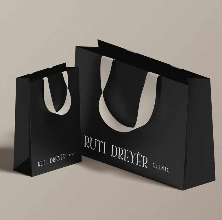 a black and white shopping bag with a white background