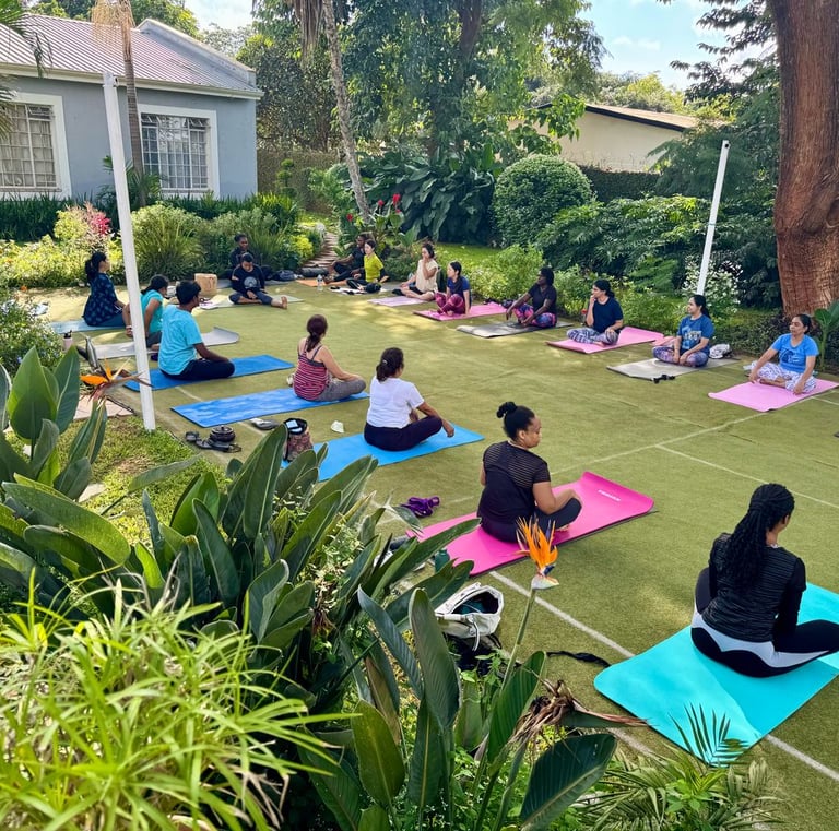Ongoing class with Yoga participants demonstration of correct posture