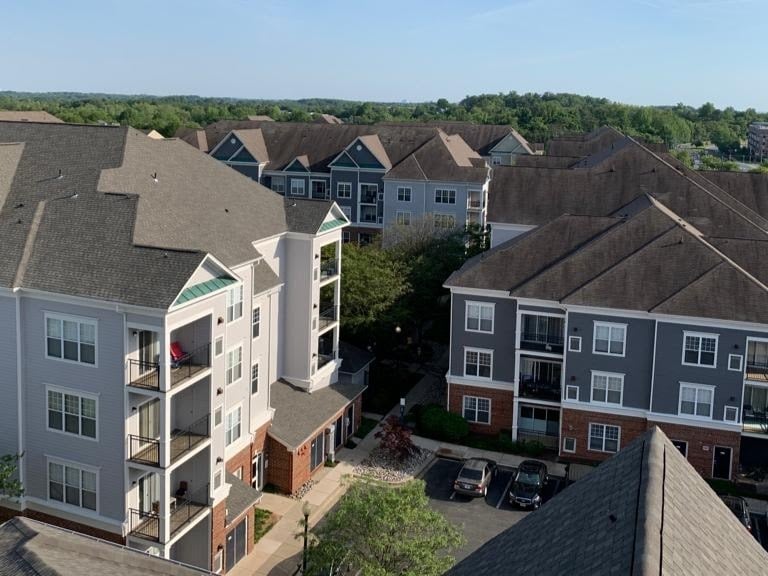 Aerial view of an apartment complex exterior painting project by Garnet Painting & Remodeling in Douglas, GA.