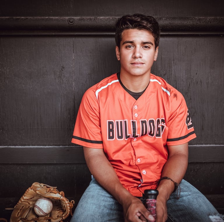 a man in a baseball uniform is posing for a picture