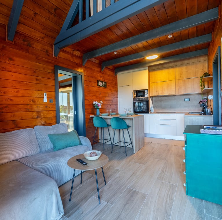 a living room with a couch and a table and counter