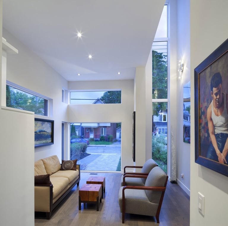 a living room with a couch and a painting