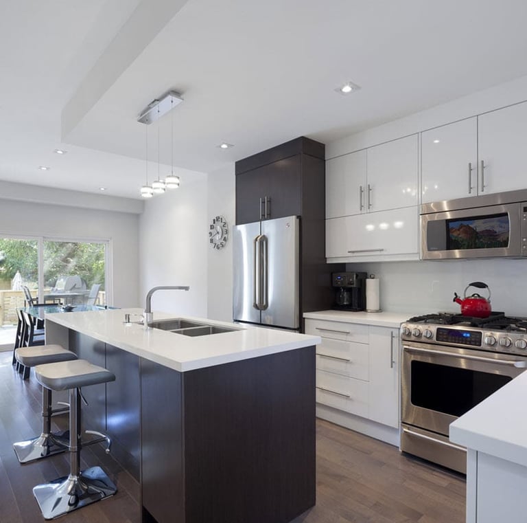 a kitchen with a stove top oven and a sink