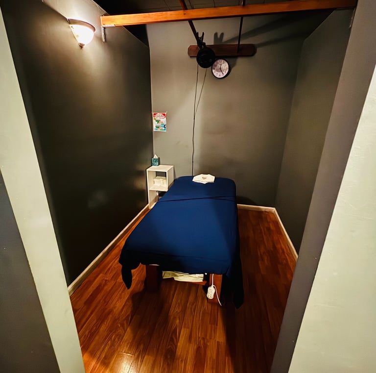 a bed in a room with a blue bed and a clock