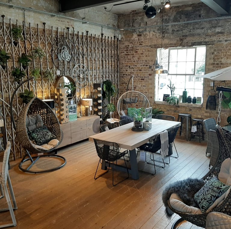 a garden room with a table and chairs and accessories
