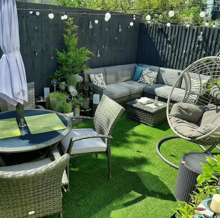 a patio with a table and chairs and a table