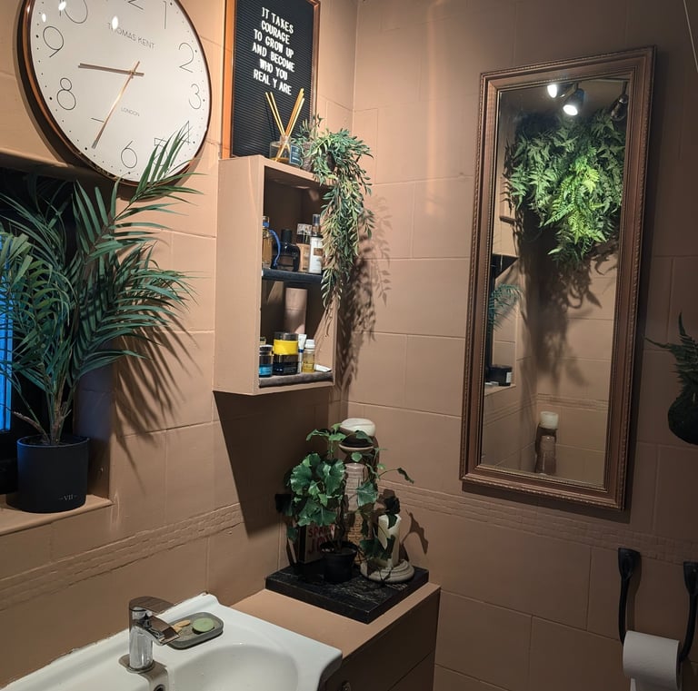a bathroom with a clock, mirror and plants ideas