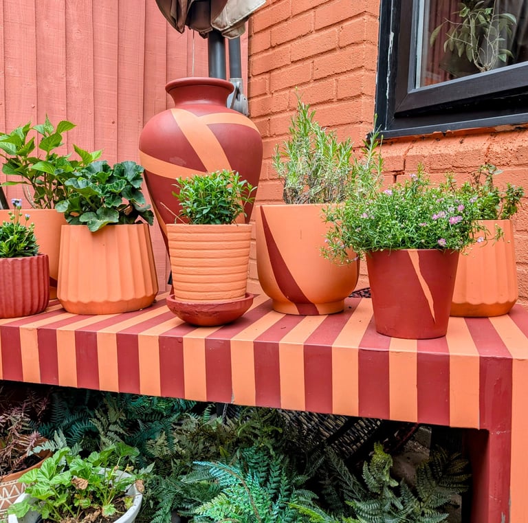 stripe concerete bench with matching pots and plants
