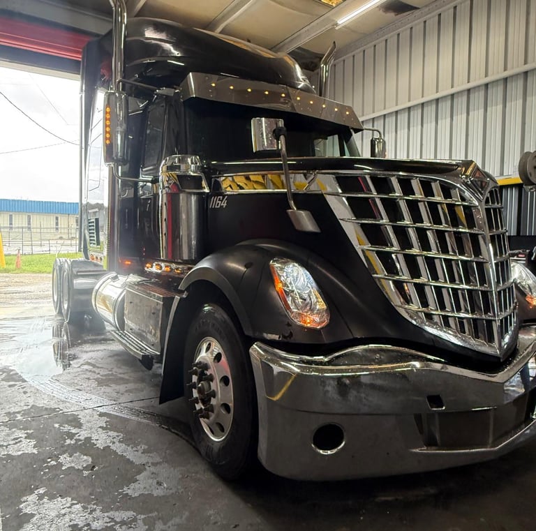 a semi truck parked in a garage