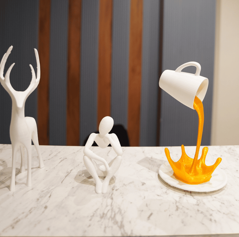 a person pouring orange juice into a cupcake